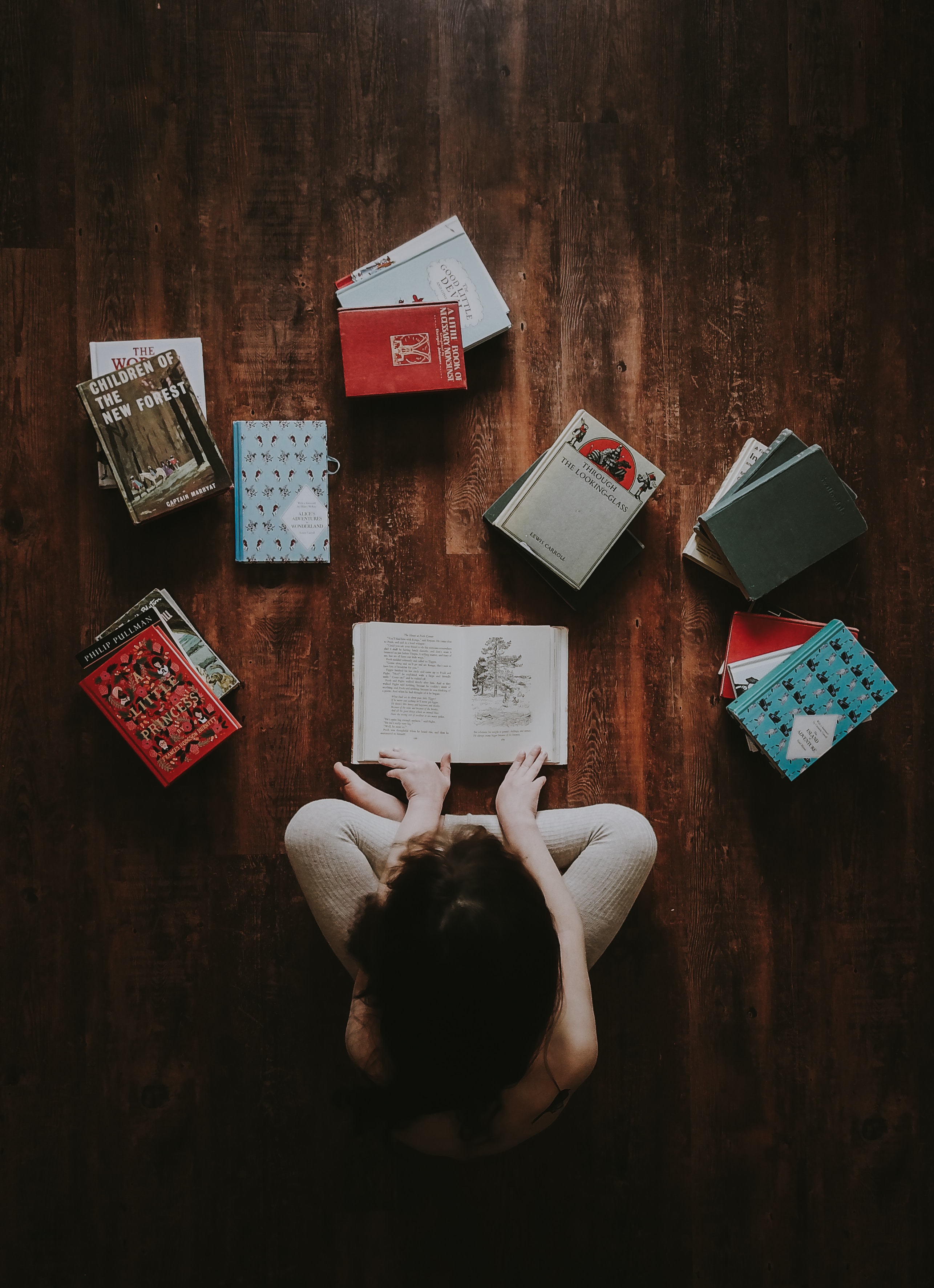a child surrounded by books